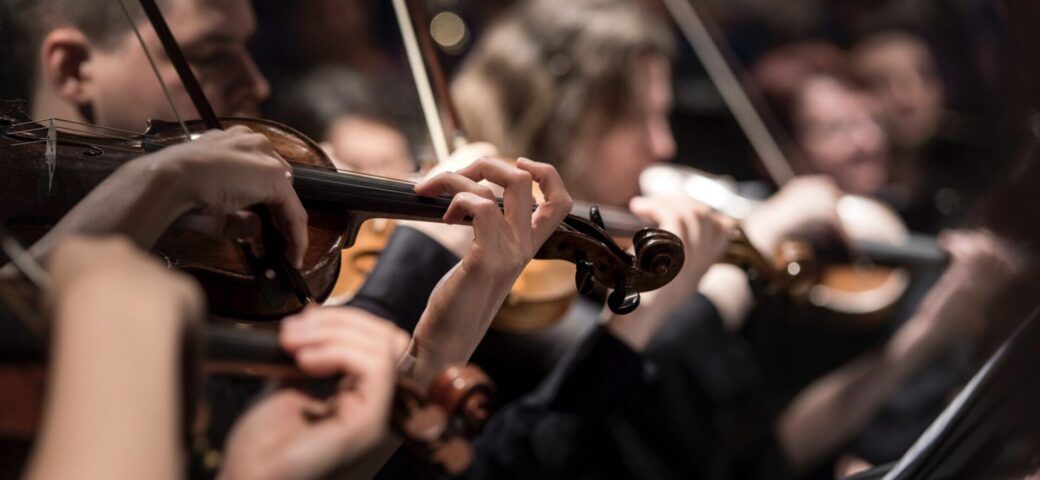 orchestra playing violins